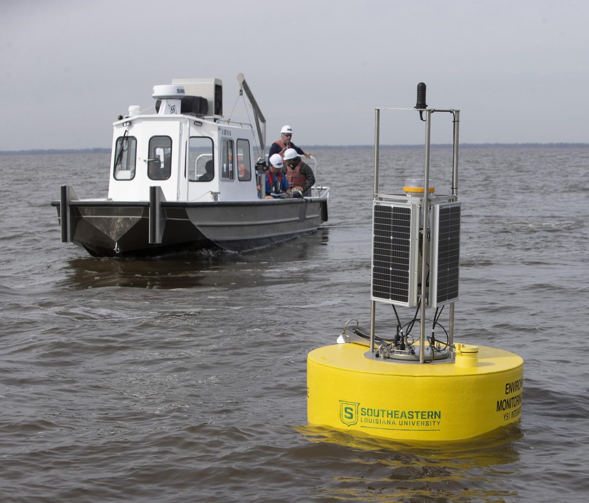 BUOY+DEPLOYMENT+%E2%80%93+Members+of+the+buoy+deployment+team+leave+the+area+after+the+deployment+of+one+of+four+buoys+in+Lake+Maurepas.+Scientists+from+Southeastern+Louisiana+University+will+be+monitoring+the+marine+life+populations+%28fishes%2C+crabs%2C+shrimp%29%2C+as+well+as+the+plant+life+in+the+surrounding+wetlands%2C+and+also+watching+and+studying+any+variations+in+water+quality+with+data+from+the+buoys.